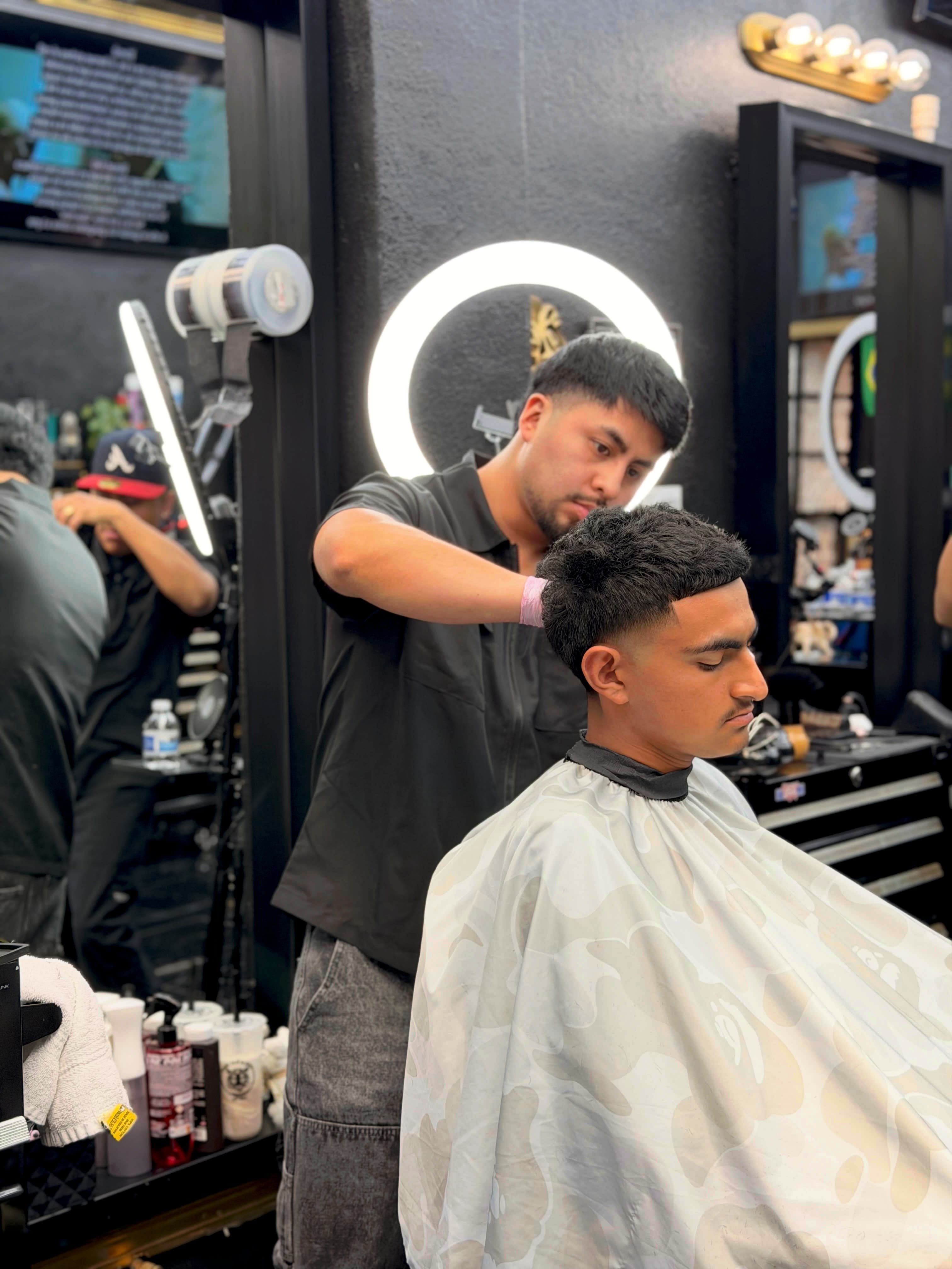 Client haircut and finish at Lion's Den Shave Parlor