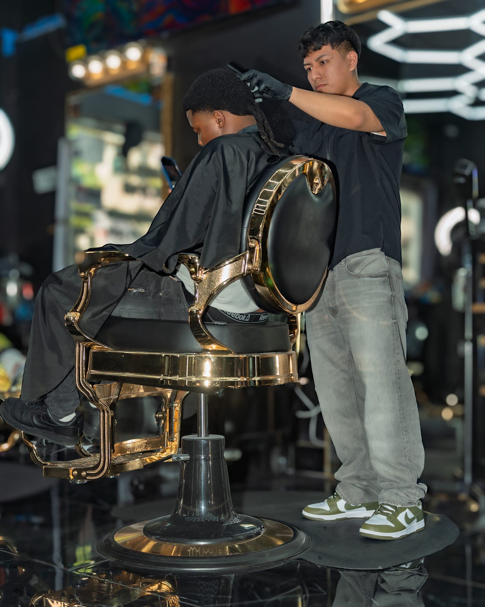 Barbershop work — cut and style at Lion's Den Shave Parlor